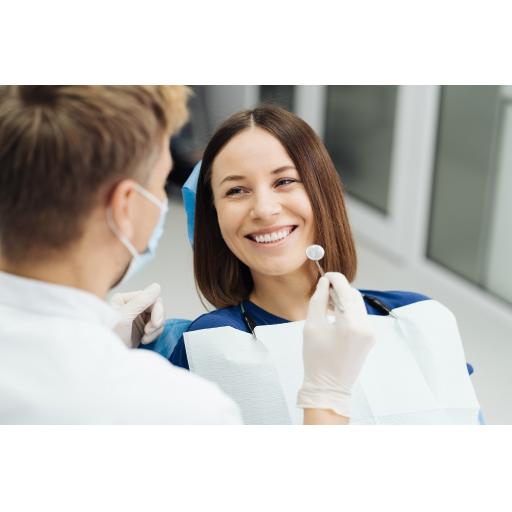 male-professional-dentist-with-gloves-mask-discuss-what-treatment-will-look-like-patient-s-teeth.jpg