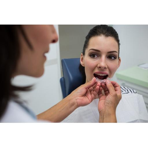 dentist-assisting-patient-wear-invisible-braces.jpg