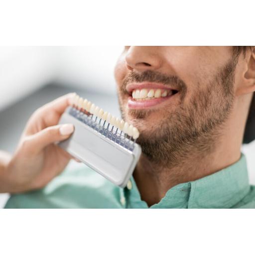 dentist-choosing-tooth-color-patient-clinic_380164-197899.jpg